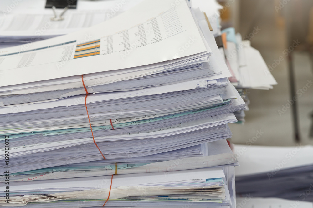 Close up of business documents stack on desk , report papers stack