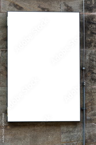 Blank ad space sign isolated in the street on a wall