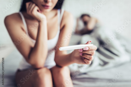 Couple with pregnancy test photo