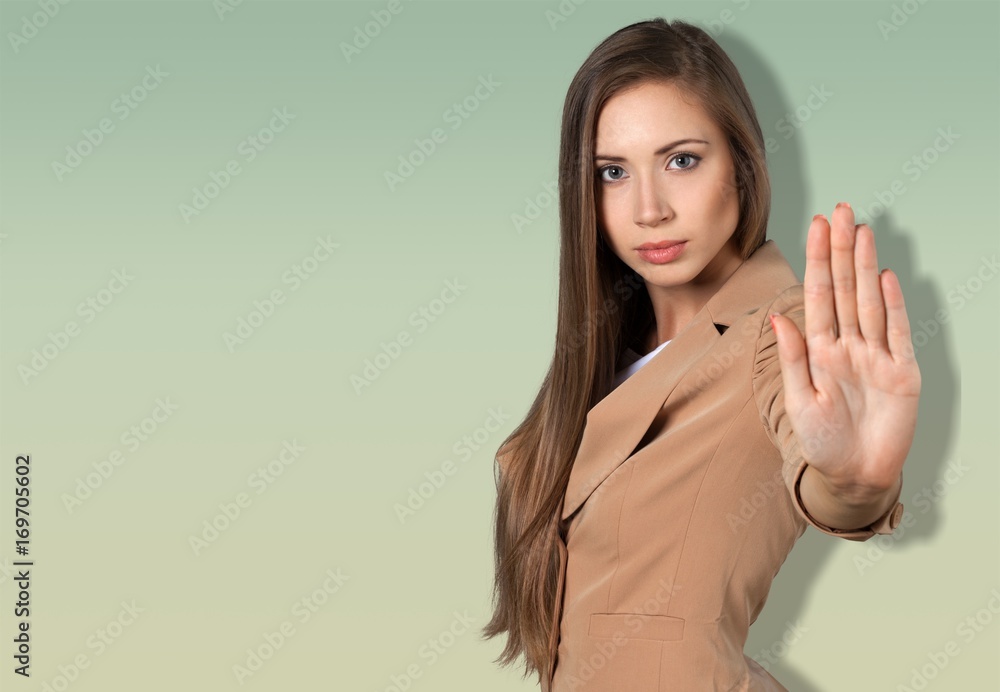 Woman making stop gesture with her hand. Woman making stop gesture with her hand.