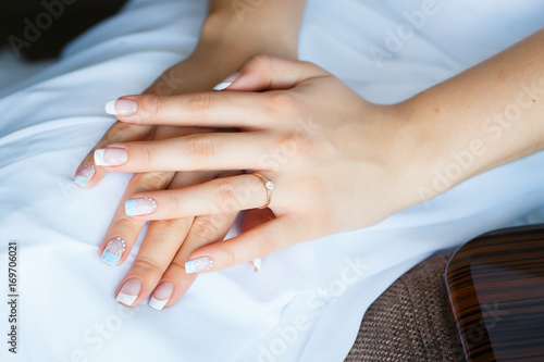 Gold wedding rings in the hands of bride