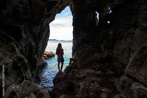 Travel people women tourist in a cave near the sea in Keo Sichang, Thailand. Travel Concept
