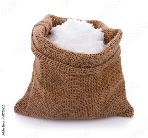 Sea salt in jute sack on white background