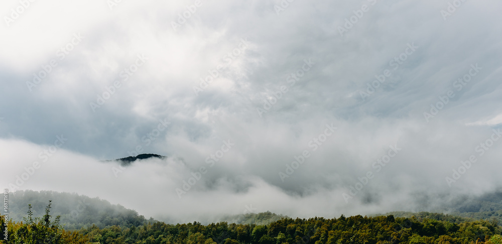 Mountains in foggy clouds Mountains in foggy clouds
