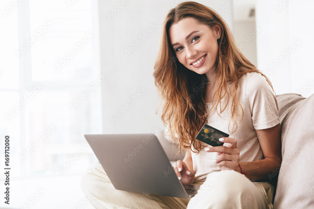 Beautiful woman showing credit card to camera Beautiful woman showing credit card to camera