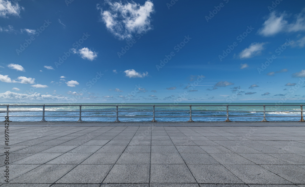 Empty Promenade and Blue Ocean Background