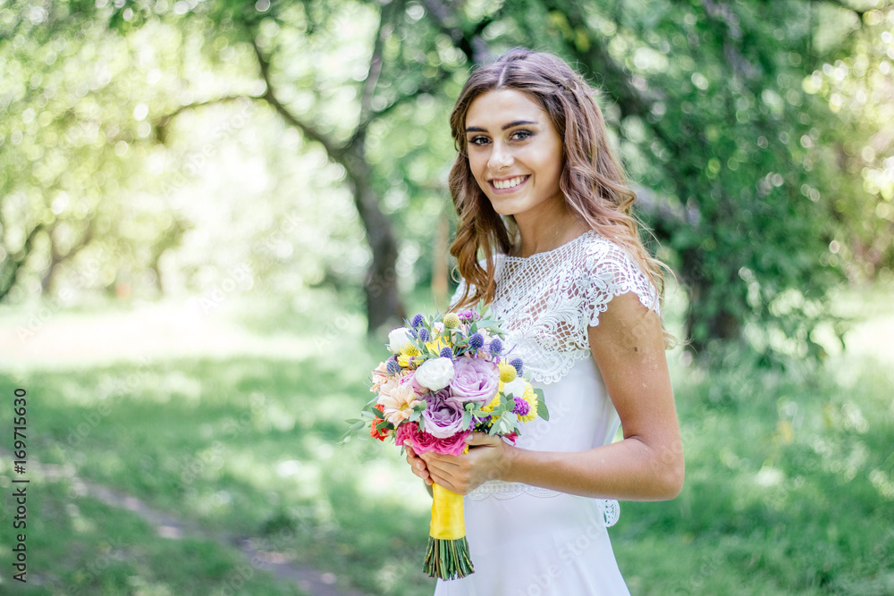 Wedding scene - bride with flower bouquet outdoor Wedding scene - bride with flower bouquet outdoor