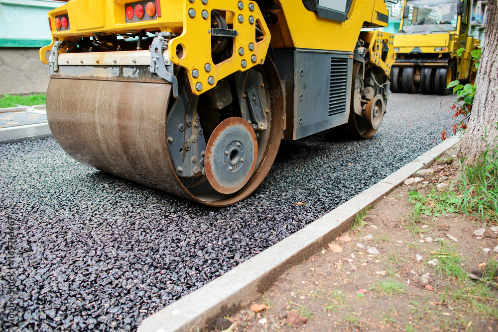Background of asphalt roller that stack and press hot asphalt. Road repair machine