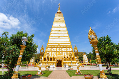 Beautiful pagoda Wat Phrathat Nong Bua Temple in sunshine day at Ubon Ratchathani, Thailand photo