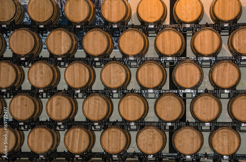 Stacked Wooden Wine Barrels © solanaphoto