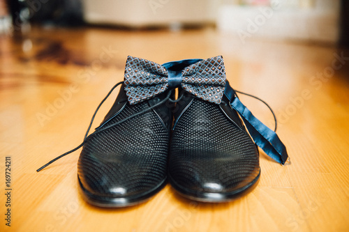 Male groom set of shoes and bow tie 