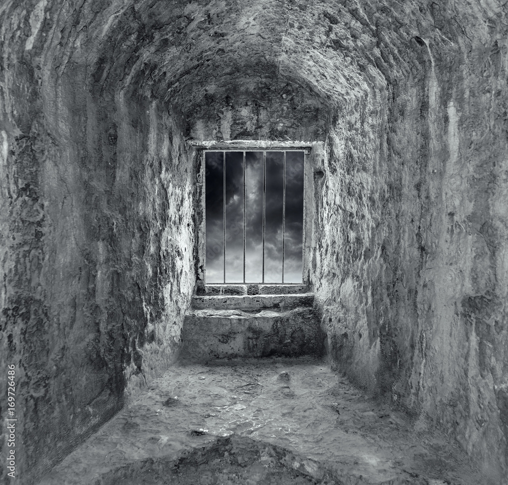 Stone dungeon with window and bars. Stone dungeon with window and bars.