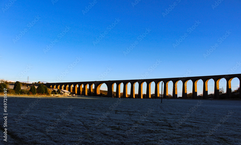 Winter's sunset view of the frosty Culloden Viaduct also known as the Clava Viaduct or the Nairn Viaduct in the Scottish Highlands.