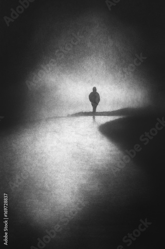 lonely person walking with grungy textures photo