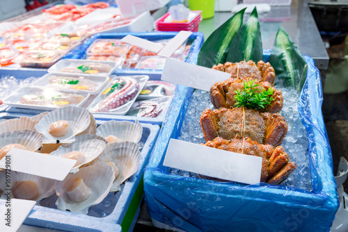 Shoppers visit Stalls selling fish in the tsukiji fish market is the biggest wholesale fish and seafood product market in the world, fresh seafood product