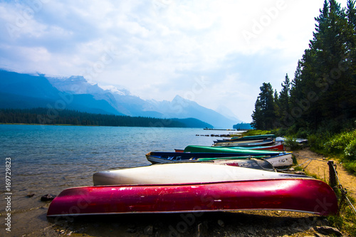 Billede på lærred upside down canoes at a mountain lake in Canada