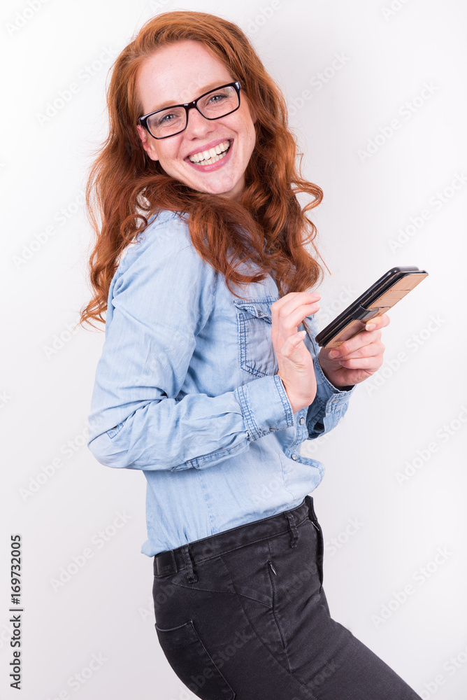 attractive young woman likes what she sees on the smartphone attractive young woman likes what she sees on the smartphone