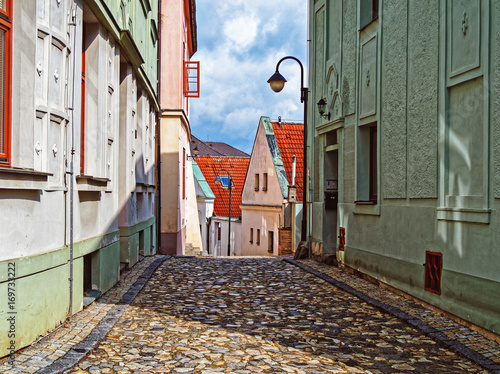 Fotótapéta Narrow street covered with stone blocks in the town of Tábor, Czech Republic