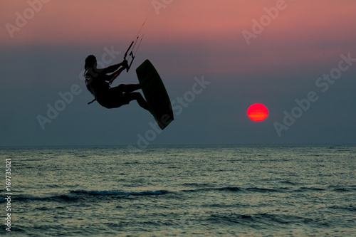 Kite boarding. Kitesurf freestyle at sunset.