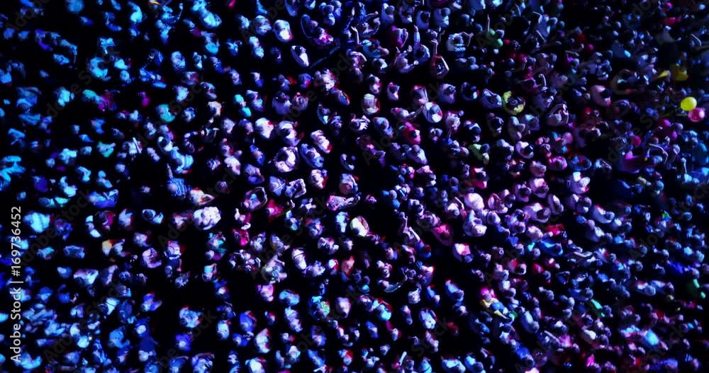a crowd of people at a concert. drone point of view
