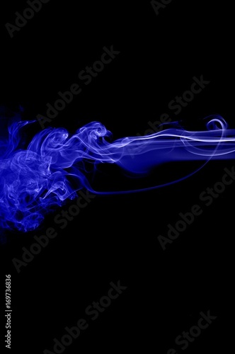 Abstract blue smoke on black background,blue ink background