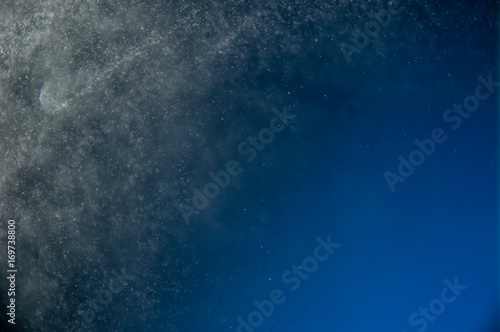 abstract water spray on blue background 