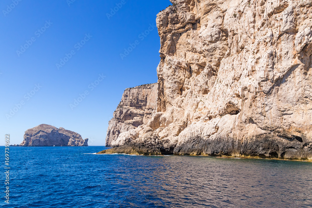 Sardinia, Italy. Scenic rocky shore against the blue sky and the calm sea