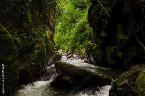 exit of rough mountain river from rock