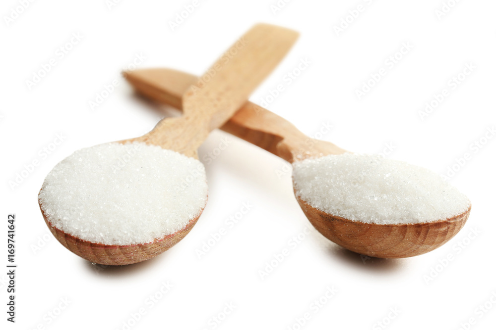Sugar in spoons isolated on white background Sugar in spoons isolated on white background