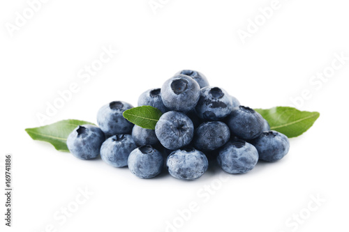 Ripe blueberries with green leafs isolated on white background