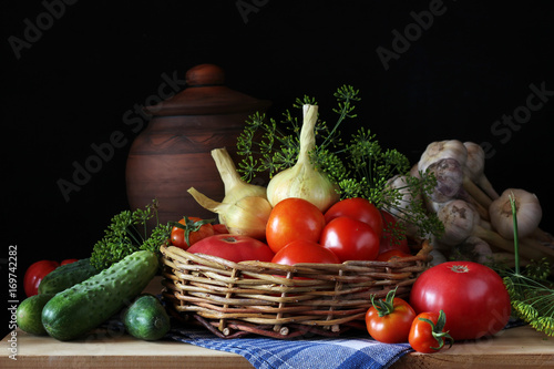 Obraz na płótnie Vegetables and a basket on the shelf. Still life.