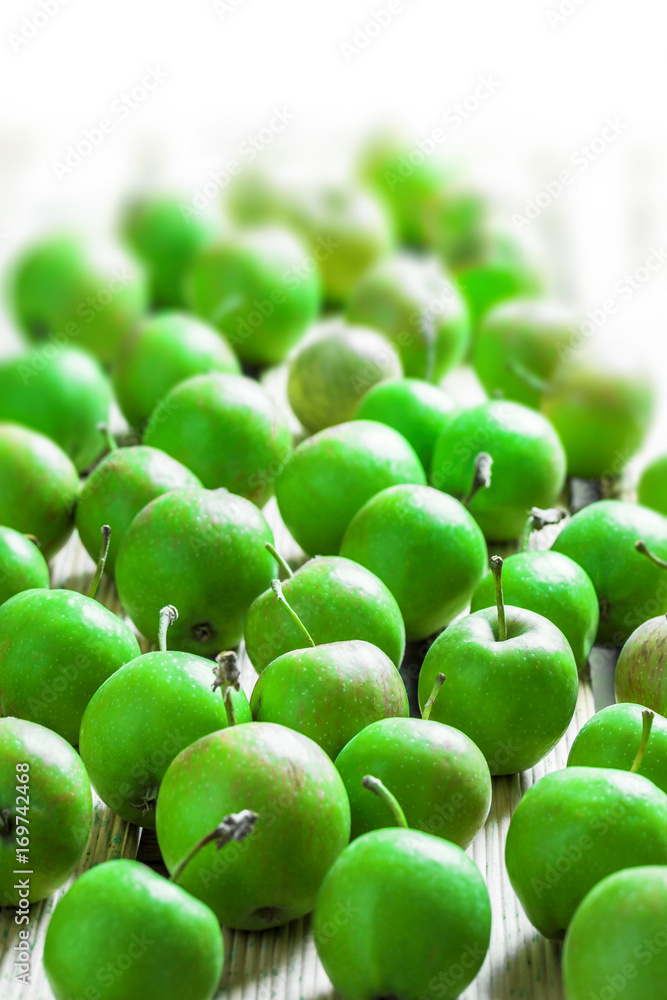 Green organic apples large group on white background in studio Green organic apples large group on white background in studio