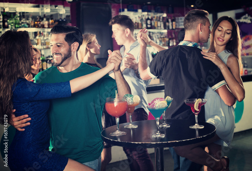 Couple dancing passionately in pair in the nightclub