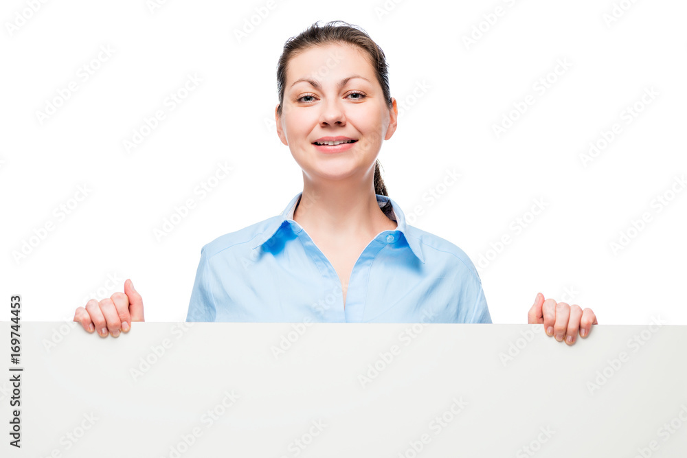 Happy successful business woman lady holding a big poster in front of a white background Happy successful business woman lady holding a big poster in front of a white background
