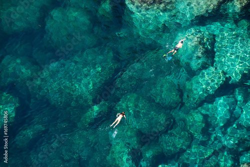 Drone picture of a couple snorkeling in the sea