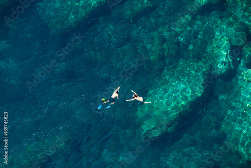 Above view of a couple snorkeling in the sea