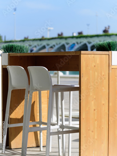 Outdoor restaurant dining table in sun in Valencia city of scince and arts for tow persons. Side view1 © Alex Kiriuchkov