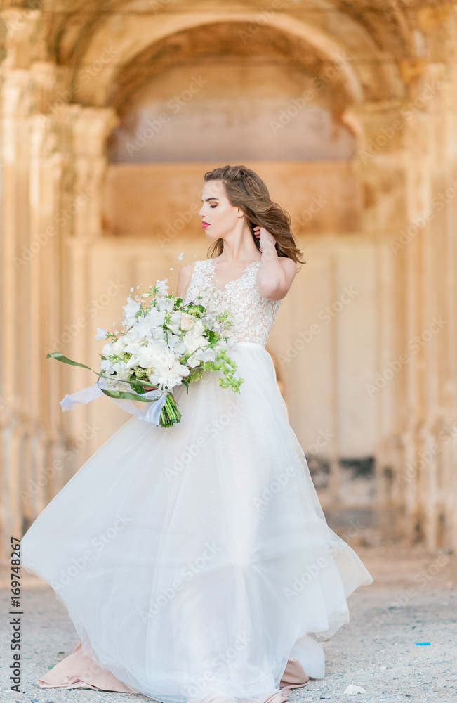 pretty bride woman in elegant white lace dress with wedding bouquet pretty bride woman in elegant white lace dress with wedding bouquet