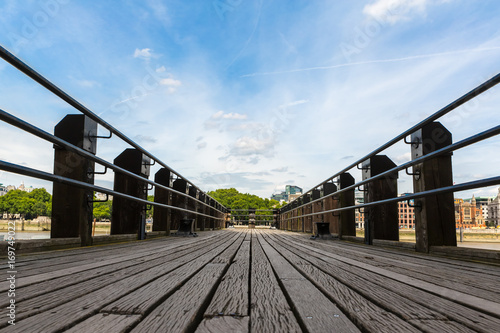 Wooden Pier. Low angle view of a wooden pier stretching out into the distance. London, UK.