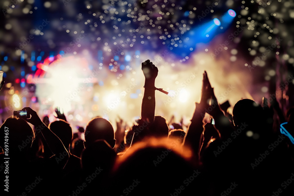 crowd with raised hands at concert - summer music festival