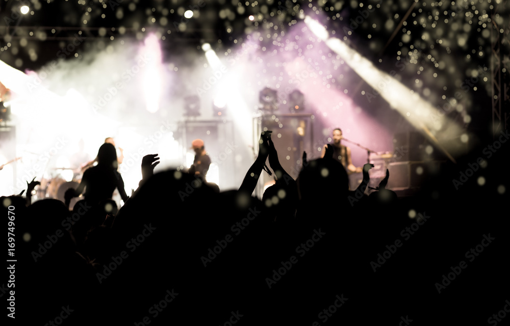 crowd with raised hands at concert - summer music festival