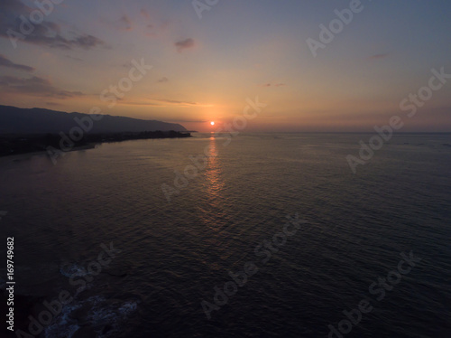 Aerial view of the setting sun at Kaena point on the north shore of Oahu Hawaii
