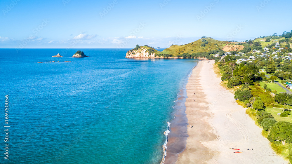 Aerial view on beautiful harbour with sunny beach and surrounding hillside, Coromandel,  New Zealand
