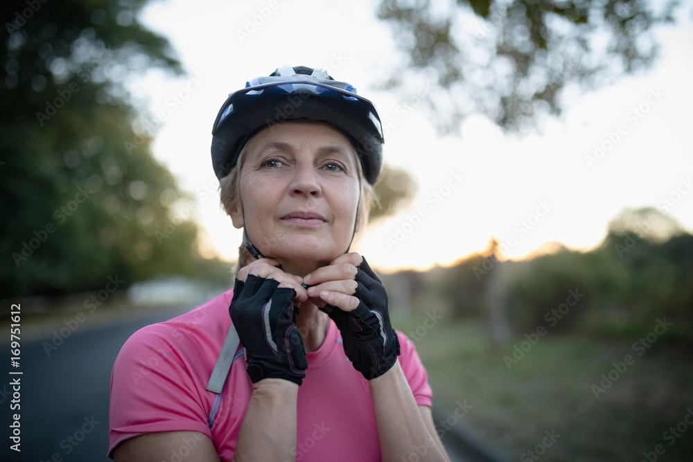 Woman wearing bicycle helmet Woman wearing bicycle helmet