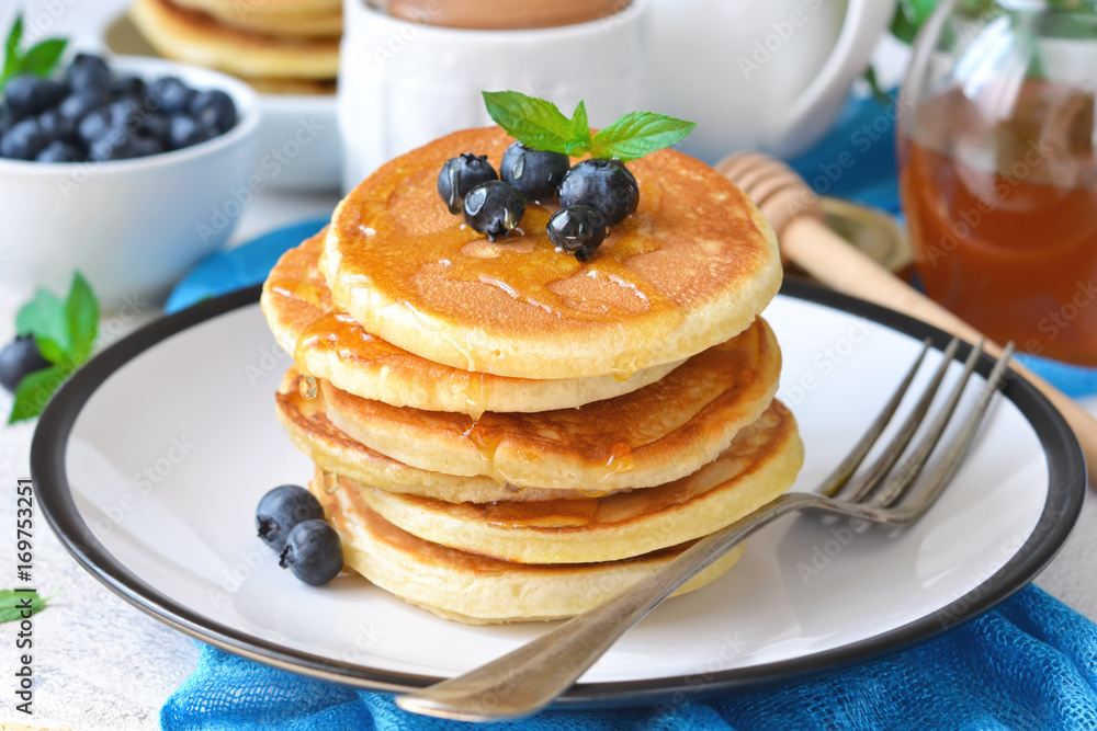 Homemade vanilla punkcakes with syrup and blueberries for breakfast. Good morning! Homemade vanilla punkcakes with syrup and blueberries for breakfast. Good morning!
