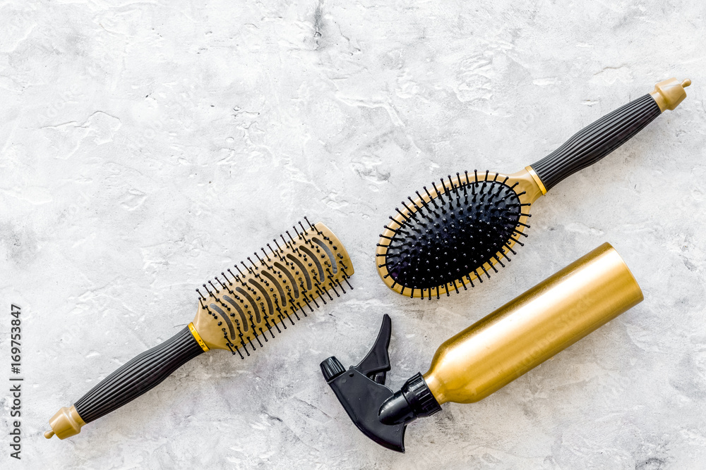 hairdresser work with combs and brushes for styling and dyeing on stone background top view space for text hairdresser work with combs and brushes for styling and dyeing on stone background top view space for text