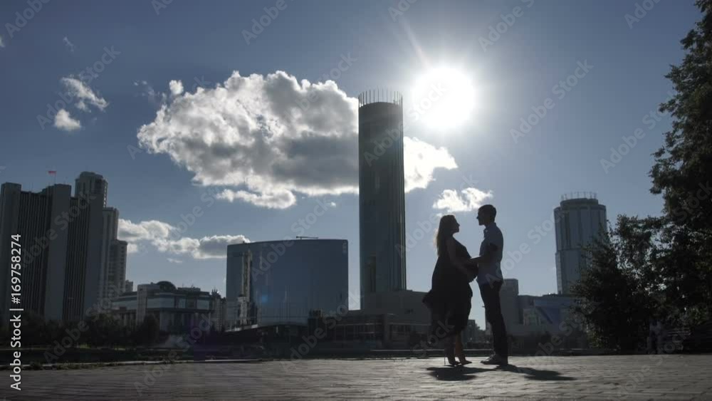 Couple holding hands on city street Couple holding hands on city street