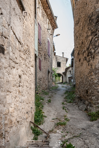 Authentic French town with narrow streets, colorful houses and atmospheric flowers. © fotografiecor