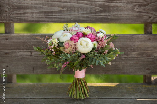 beautiful wedding bouquet of roses, peonies and other flowers