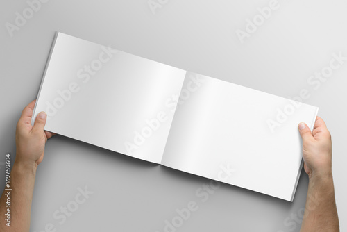 Fototapeta Naklejka Na Ścianę i Meble -  Blank A4 photorealistic landscape brochure mockup on light grey background. 